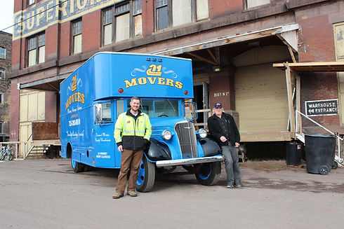 Past Owner John and Current Owner Chris on A-1 Movers Truck