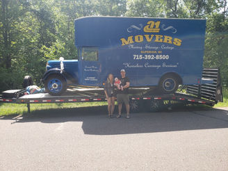 A-1 Movers President and Vice President in front of Truck