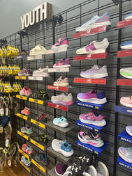 Youth athletic shoes displayed at Benders Shoes Clothing & Gifts