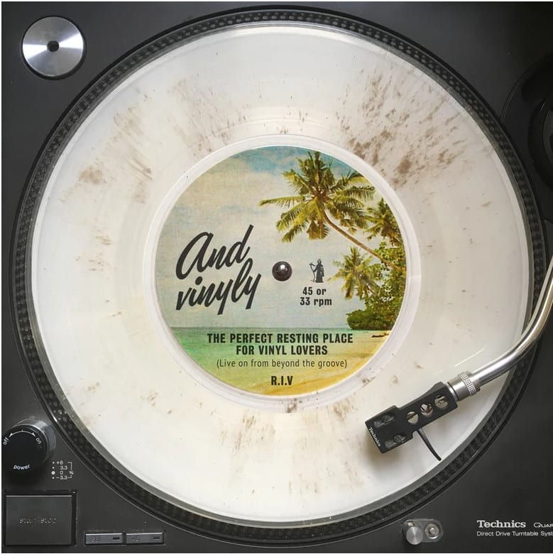 a vinyl record with ashes pressed into it
