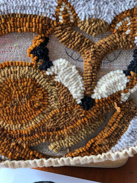 Fox hooked chair pad in the process of being worked on