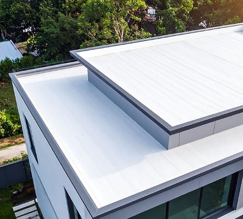 Commercial roofing crew installing a new TPO roof during a full roof replacement on a commercial building in Goshen, Indiana.
