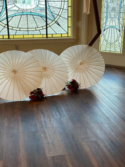 paper umbrella in front of arch