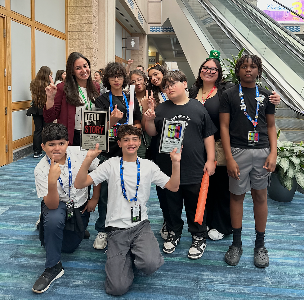 Group of Python TV students holding awards at a competition, indoor convention center, landscape photo.