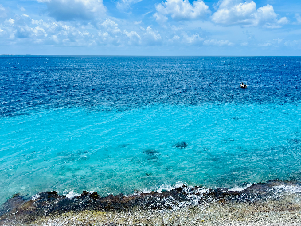 Eye-level view of Pink Beach with soft sand and turquoise waters