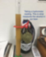 Taking a hydrometer reading