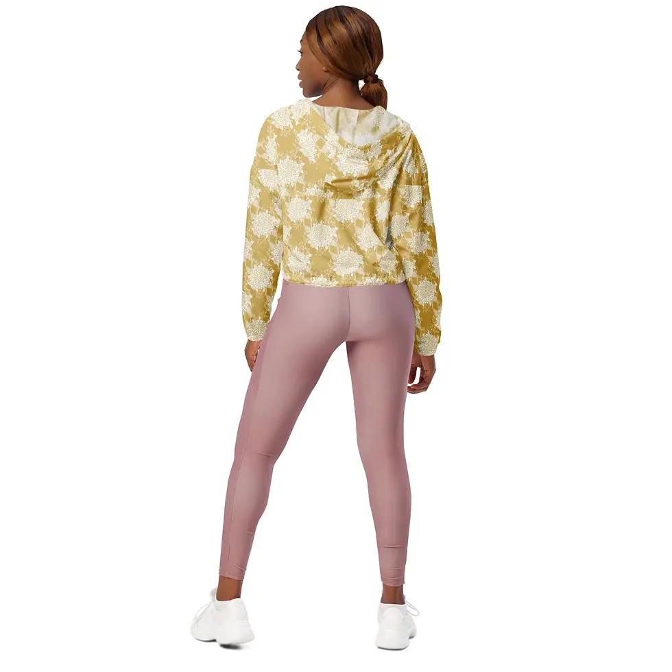 Thumbnail: Woman wearing a patterned hoodie and pink leggings, viewed from behind.