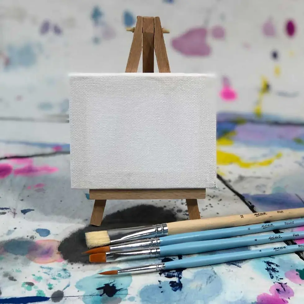 Thumbnail: Miniature easel with blank canvas and paintbrushes