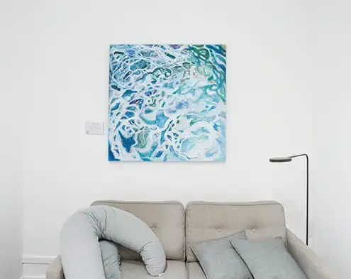 Abstract painting above gray couch, best way to display art