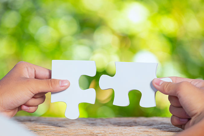 world-habitat-day-close-up-picture-of-piece-of-white-jigsaw-in-each-hand.jpg