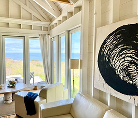 view of the living room in Cape Cottage looking out over the ocean