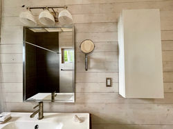 close-up view of the bathroom sink and cabinet at TwoBySea cottage