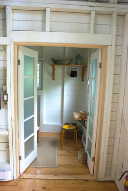 view of open doors leading into second bedroom at DeepBlueSea Cottage