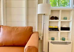 closeup of the leather couch and shelf