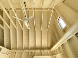 white-washed wooden rafters and spacious ceiling TwoBySea cottage