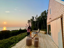Sunsets never disappoint! Couple watching the sunset from the deck