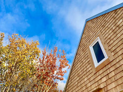 Cape Breton-style architecture at TwoBySea cottage, looking up at the beautiful blue sky