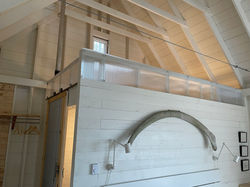 whale rib hanging on the wall at TwoBySea cottage