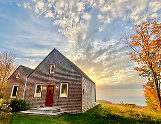 evening sun behind Cape Cottage