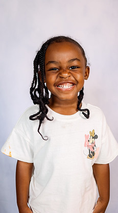 Yearbook photo of a Beyond the Books Academy (BTBA) student smiling in a white shirt..