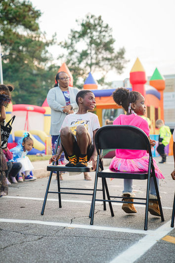 Students and parents enjoying a holiday-themed school event