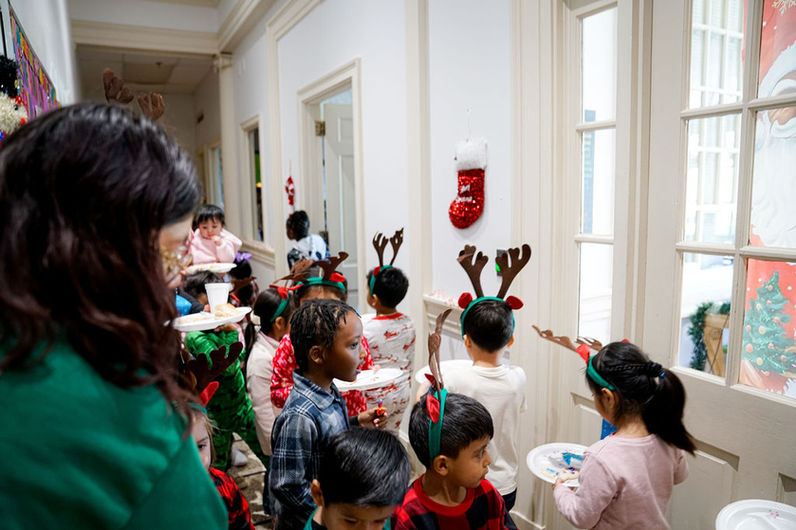 Students and parents celebrating at a festive Christmas event