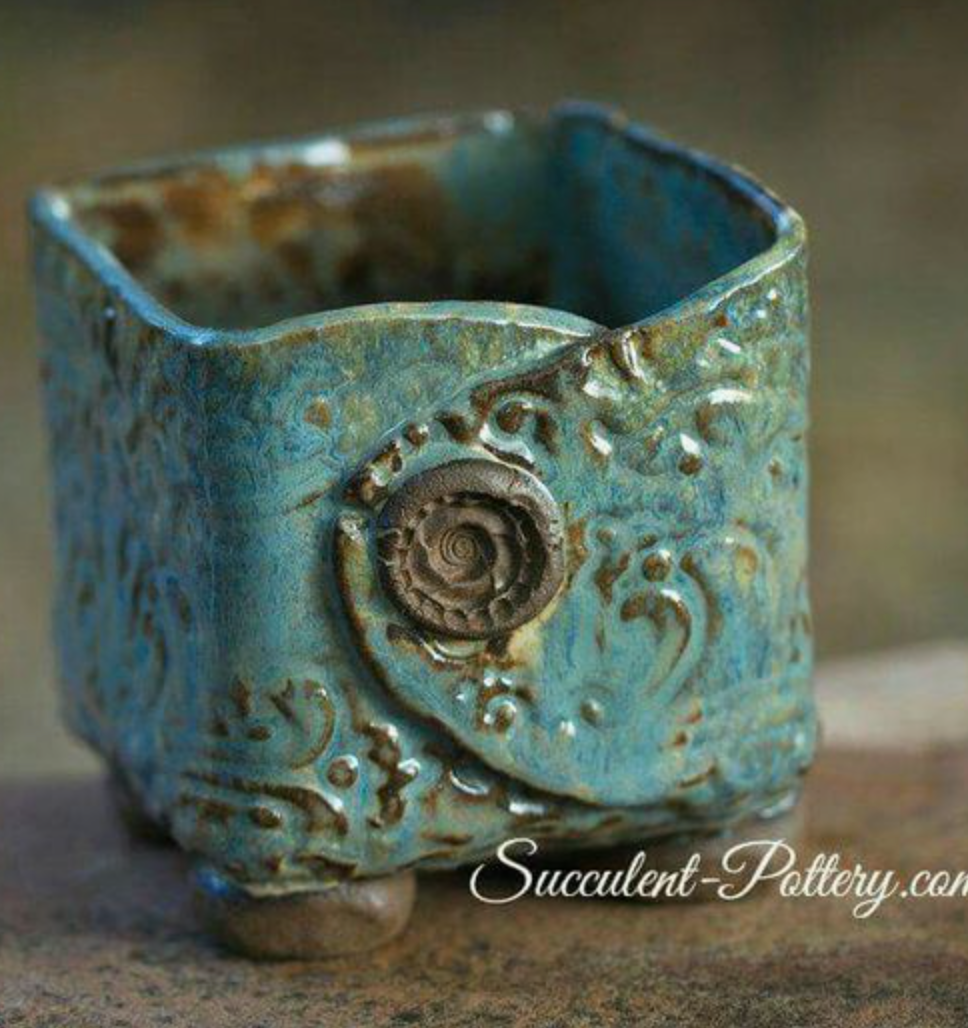 Handbuilt cup with button