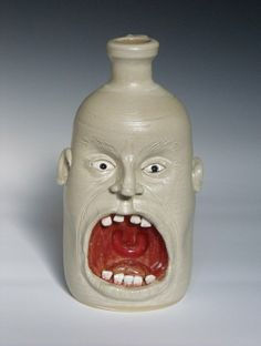open red mouth face mug
