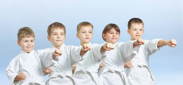 stock-photo-five-children-hit-punch-light-background.jpeg