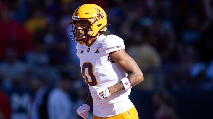 Tyson battles through contact while hauling in a catch for ASU during that heated rivalry game. Photo by Mark J. Rebilas / Imagn Images, via Sports Illustrated 