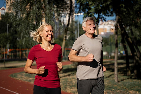 smiley-older-couple-jogging-outdoors.jpg