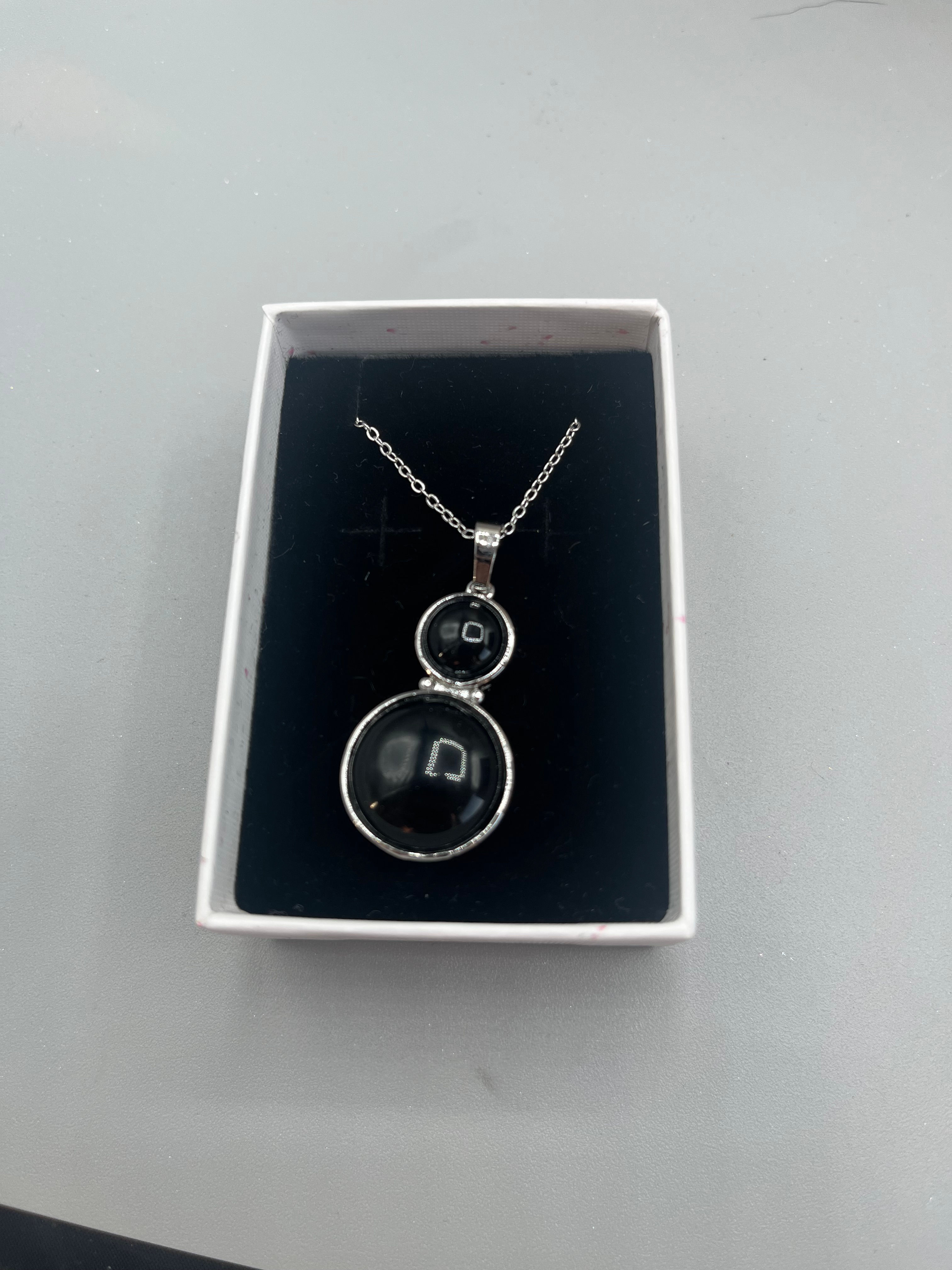 Black obsidian double circle pendant on 22cm chain