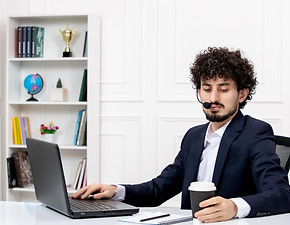 customer-service-handsome-curly-man-office-suit-with-computer-headset-holding-coffee.jpg