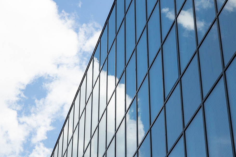 modern-high-building-facade-business-centre-apartment-with-many-windows-sky-with-clouds-on