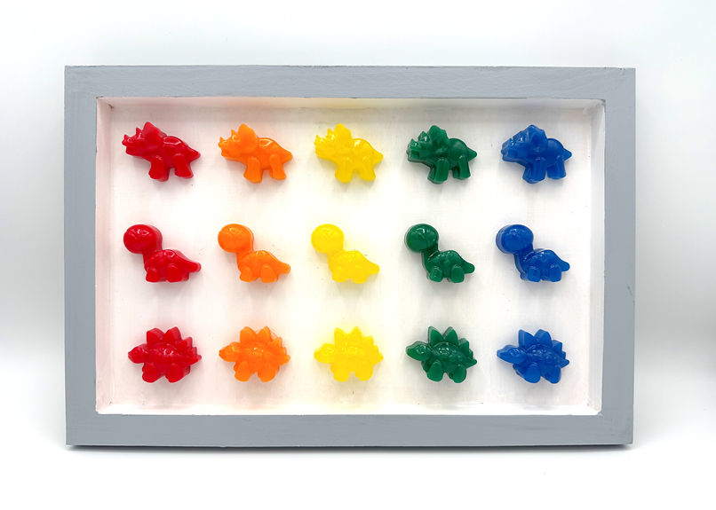 Rainbow colored dinosaurs on a white background with grey frame