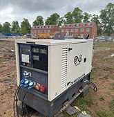 D&S Power generator connected to temporary power cables on a construction site