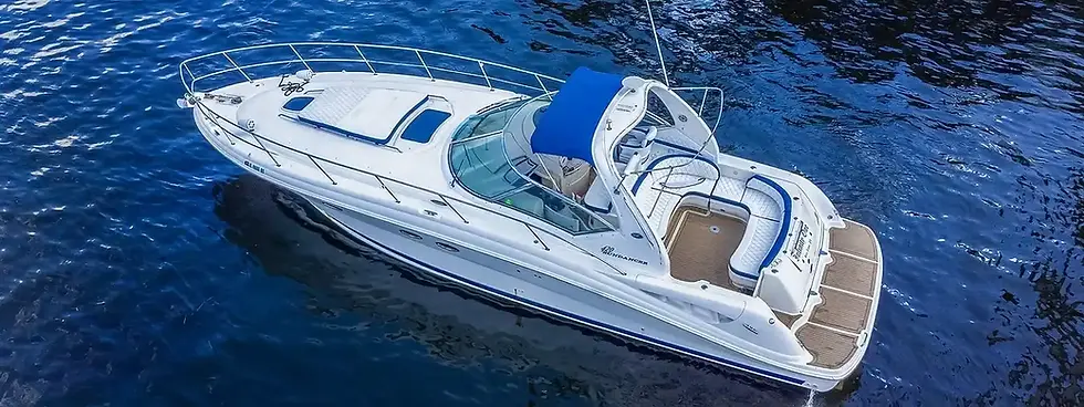 Elegant white yacht with a blue canopy on calm waters, perfect for boat rental in St. Petersburg.