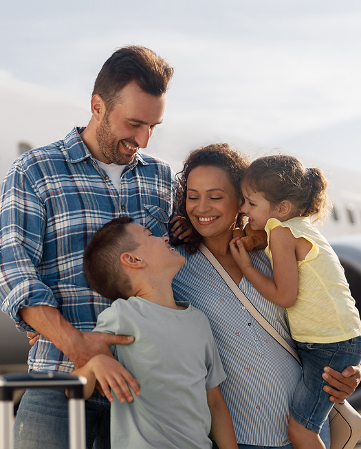 family-four-looking-excited-while-going-trip-standing-front-big-airplane-outdoors.jpg