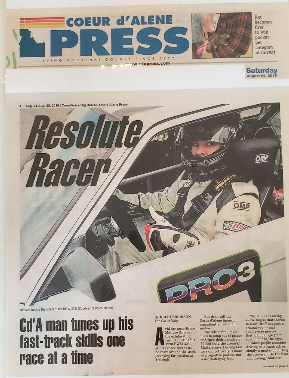 Coeur d'Alene Press: 'Resolute Racer' headline, race driver in car