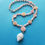 Thumbnail: Ocean Bloom Beaded Necklace — Queen Conch & Albino Nutmeg