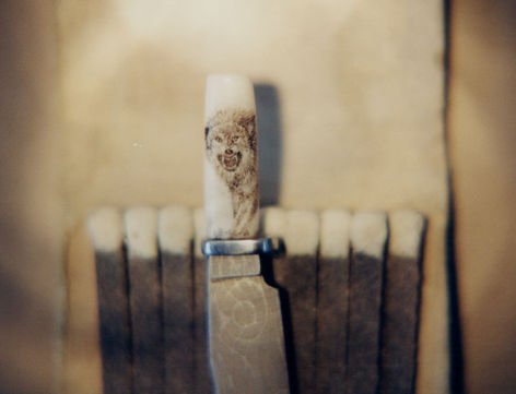 Wolf on miniature knife