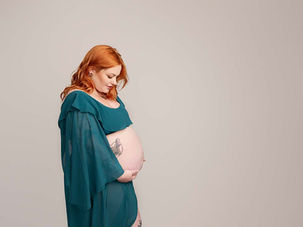Photo of pregnant lady in teal dress in Maternity photoshoot Victoria Dock