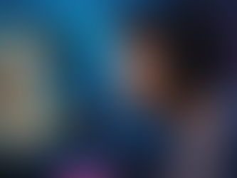 video game player looking at the computer screen showing a fantasy elf character