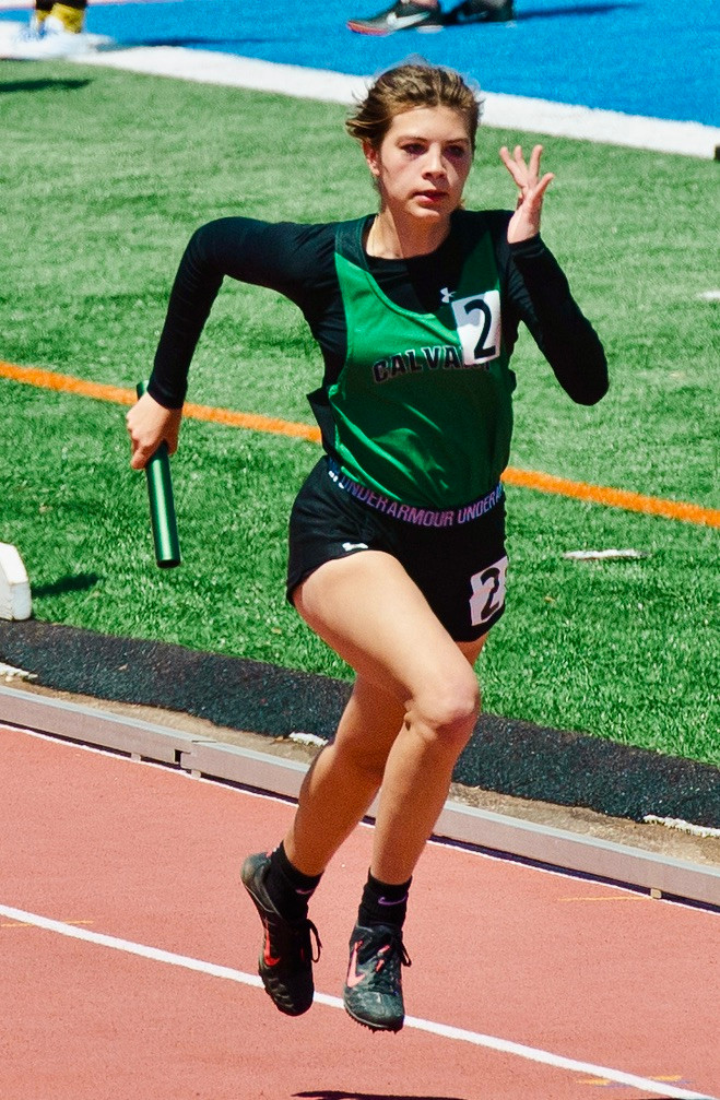 Remington running in the 4x100 @ TAPPS Regionals