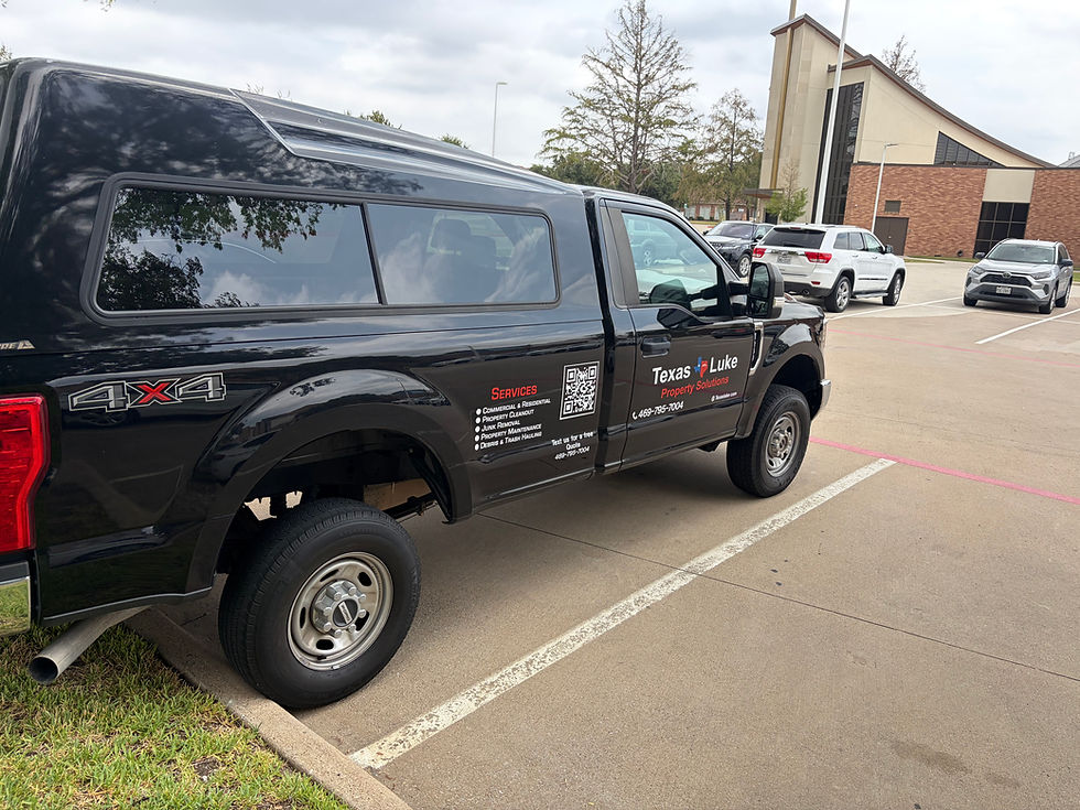 Black truck parked at a junk removal service location.