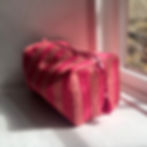 Large Cotton Washbag - Pink & Pink Stripe displayed on window sill