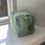 Thumbnail: Large Cotton Washbag - Green Stripe displayed on window sill showing end of bag