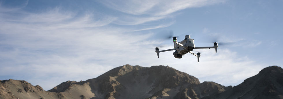 A drone flying over a desert environment