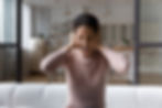 Too much noise. Anxious young hispanic woman shout stop cover ears with palms unable to he