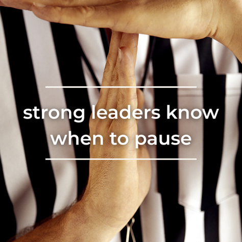 Image of a referee doing a time out signal with the words "strong leaders know when to pause" superimposed